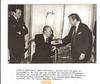 Item #20292 Signed photograph of Borges receiving the gold medal of the Académie Française....